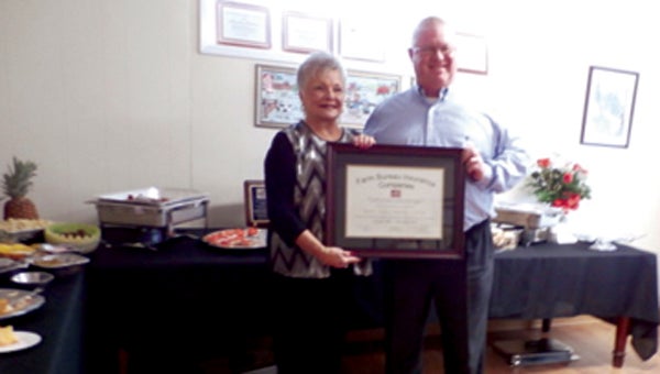 Henry Hamill, Vice President-Sales with Mississippi Farm Bureau presented a Certificate of Appreciation to Mary Jean Hamby recognizing 27 years of service to Mississippi Farm Bureau Insurance.