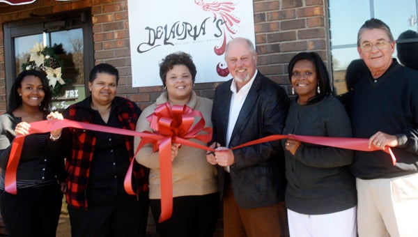 Karen Sanford / The Prentiss Headlight – DeLauria’s Boutique / Books / WiFi Café opened their doors this week. On hand for a new business ribbon-cutting was (l to r) Joi Brown, Dedra Brown-Johnson, Owner Laurinda Brown-Johnson, Charley Dumas, Jerleen White and Ben Hamby.