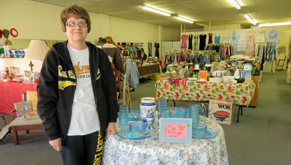 Shirley Burnham / The Prentiss Headlight – Terri Speights shows off the "pre-loved" merchandise in her newly-opened store, Inside Sale. 