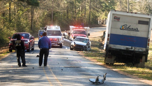 Karen Sanford / The Prentiss Headlight –Kristen McRaney of Bassfield was involved in a car crash on Monday morning with a log truck. She was taken to Forrest General Hospital with injuries. Above, emergency personnel respond to the accident on North Williamsburg Road in Bassfield. 