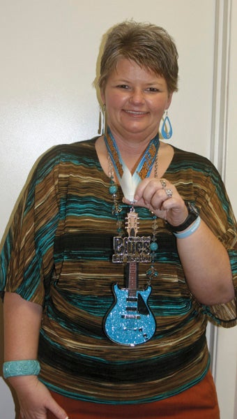 Karen Sanford / The Prentiss Headlight – Congratulations to Missy Jones who completed the Mississippi Blues Half-Marathon this weekend in Jackson.  Over 3,500 people participated and all finishers received a medal shaped like a blues guitar as shown above. This is Missy’s fifth year to compete in the sport.