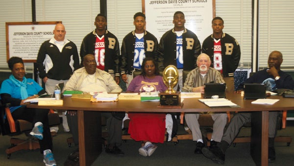 Karen Sanford / The Prentiss Headlight – The Jefferson Davis County School Board members pictured (l to r) Von Norwood, John Bass, Beulah Walker, Billy Boleware, and Jessie Holloway. Bassfield Yellowjackets pictured (standing l to r) Coach Lance Mancuso, C J Moore, Cornell Armstrong, Alvin Moore and Curtis Mikell. 