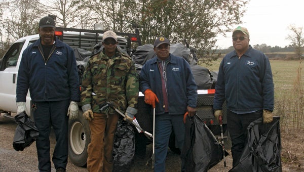 Karen Sanford / The Prentiss Headlight – In a short 3.5 mile trip, county workers in District Three picked up a truckload of trash on Thursday. Pictured above (l to r) Lonnie Graves, Minister Gitto Loftin, Johnny Reese, and Willie Free. In five days last week they picked up 2.5 tons of roadside garbage.