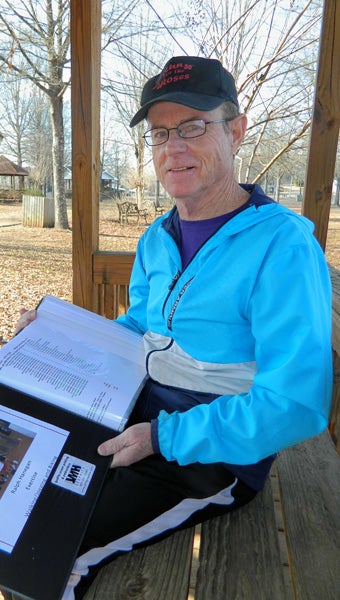 Shirley Burnham / The Prentiss Headlight — Ralph Hanegan completed a 10,000 mile journey running, walking and cycling in a five year period. Most of Hanegan’s miles were logged in on the LongLeaf Trace. His son and grandchildren joined him on some of his runs. His logbook has become a scrapbook of memories as well.