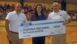 Karen Sanford / The Prentiss Headlight—Bassfield High School was the winner of the Class 2A “Text to Win” Contest. Accepting a $1,000 check from Blue Cross Blue Shield is (l to r) Coach Lance Mancuso, Meredith Virden, Manager, Corporate Communications at Blue Cross & Blue Shield of Mississippi, and BHS Principal John Daley
