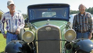 Shirley Burnham / The Prentiss Headlight—Dennis Bedwell  and Run for the Roses Committee member Sonny Everett are pictured with  Bedwell's 1931 Model A Touring 4-Door Sedan.        