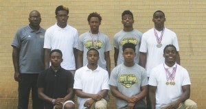 Holley Cochran / The Prentiss Headlight—Bassfield High School 2A track & field state champions: Standing L to R: Coach Charlie James, Jamal Peters, Xavier Harper, Kameron Williams,  Calvin Moore. Kneeling L to R: Dantario Magee, Curt Mikel, Cornell Armstrong, Alvin Moore. (Not pictured: James Hinton). 