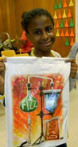 Shirley Burnham / The Prentiss Headlight—11 year-old DeJah Collins has her "goody bag" filled with fun stuff from the South MS Summer Reading Program.